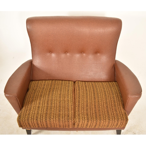 232 - A retro 20th century faux tan brown leather sofa suite. The suite comprising a two seater sofa sette... 