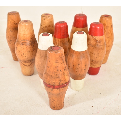 296 - A complete set of vintage early to mid 20th century carved wood & hand painted pub bowling pins / sk... 