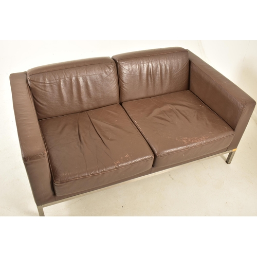 31 - Florence Knoll Style - A contemporary two seater sofa settee. The sofa comprising of brown leather c... 