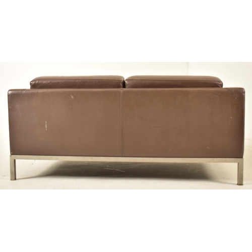 31 - Florence Knoll Style - A contemporary two seater sofa settee. The sofa comprising of brown leather c... 