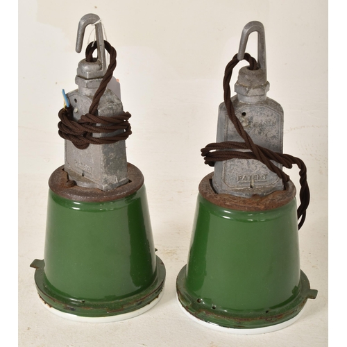 44 - A matching pair of retro 20th century industrial porcelain enamel pendant lights. Each light having ... 