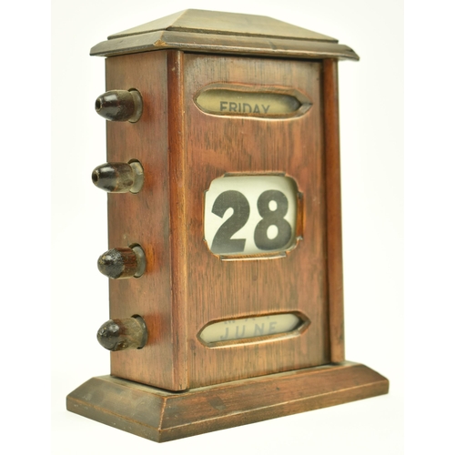 62 - An Art Deco early 20th century oak cased English perpetual desk table calendar. The calendar having ... 
