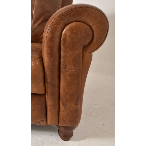 63 - British Modern Design - A retro 20th century brown leather three seater sofa settee. The sofa having... 