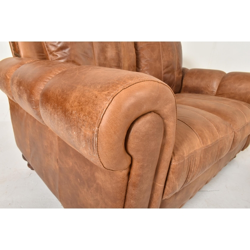 65 - British Modern Design - A retro 20th century brown leather two seater sofa settee. The sofa having a... 