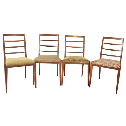 75 - A. H. Mcintosh & Co. - A retro mid 20th century teak wood extending dining table and chairs. The tab... 