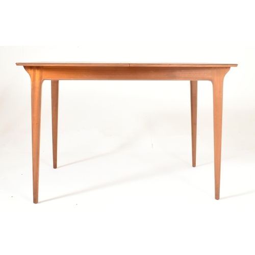 75 - A. H. Mcintosh & Co. - A retro mid 20th century teak wood extending dining table and chairs. The tab... 