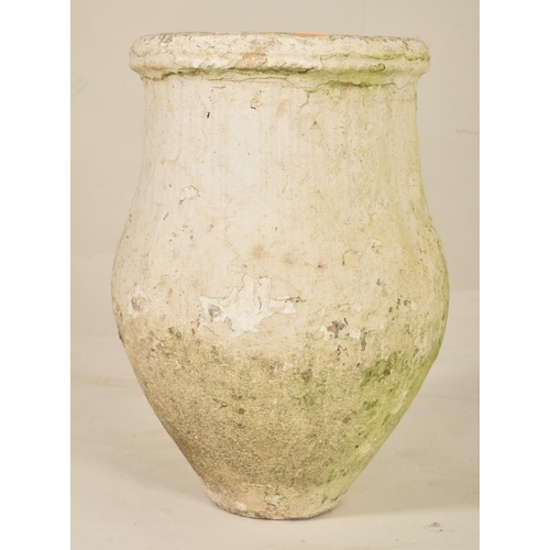 76 - A vintage 20th century ceramic stoneware amphora floor vase. The planter vase with raised rim and bu... 