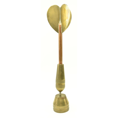 78 - A vintage 20th century brass and copper oversized darts award trophy. The trophy depicting a dart pr... 