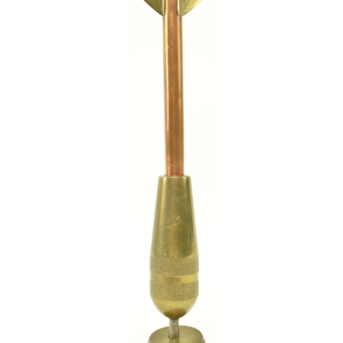 78 - A vintage 20th century brass and copper oversized darts award trophy. The trophy depicting a dart pr... 