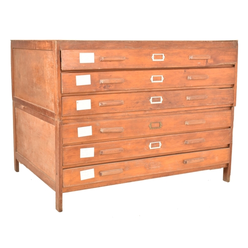 98 - A vintage mid 20th century oak and ply architects / artist's plan chest. The chest having a bank of ... 
