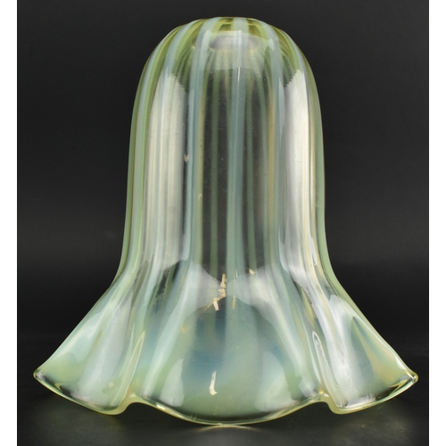 61 - In the manner of WAS Benson - An Art Nouveau early 20th century vaseline glass light shade. The shad... 