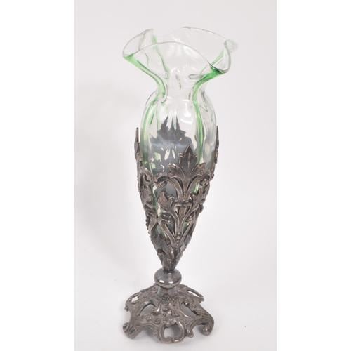 106 - A 19th century Art Nouveau Loetz manner stem / bud vase. With frilled drop in glass interior with pi... 