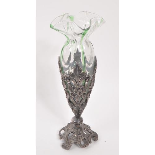 106 - A 19th century Art Nouveau Loetz manner stem / bud vase. With frilled drop in glass interior with pi... 