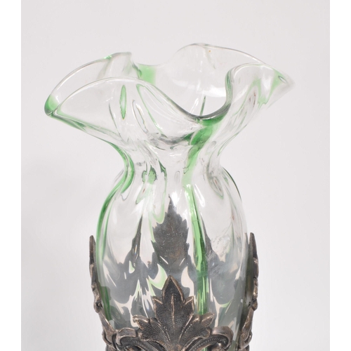 106 - A 19th century Art Nouveau Loetz manner stem / bud vase. With frilled drop in glass interior with pi... 