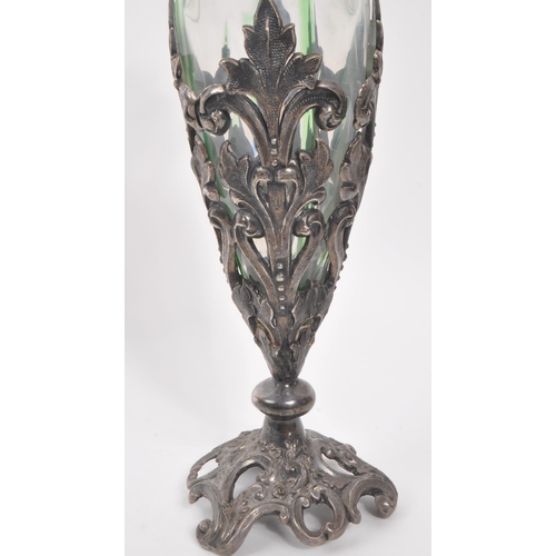 106 - A 19th century Art Nouveau Loetz manner stem / bud vase. With frilled drop in glass interior with pi... 