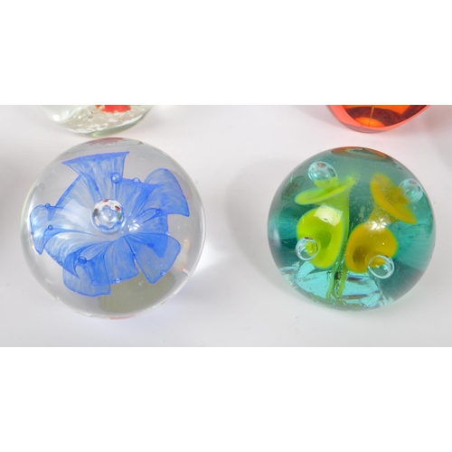 112 - A large collection of 20th century studio art glass paperweights. The collection to include ten exam... 