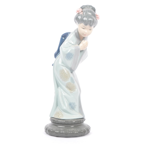 14 - Lladro - Two 20th century Lladro porcelain figures. The collection to include no.4999 Chrysanthemum ... 