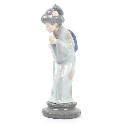 14 - Lladro - Two 20th century Lladro porcelain figures. The collection to include no.4999 Chrysanthemum ... 