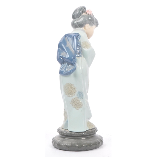 14 - Lladro - Two 20th century Lladro porcelain figures. The collection to include no.4999 Chrysanthemum ... 