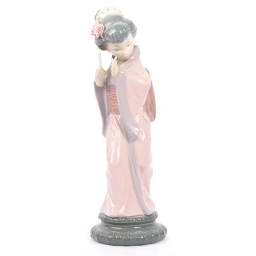 14 - Lladro - Two 20th century Lladro porcelain figures. The collection to include no.4999 Chrysanthemum ... 