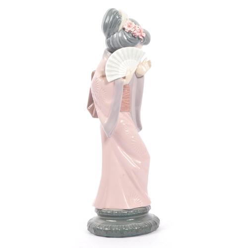 14 - Lladro - Two 20th century Lladro porcelain figures. The collection to include no.4999 Chrysanthemum ... 