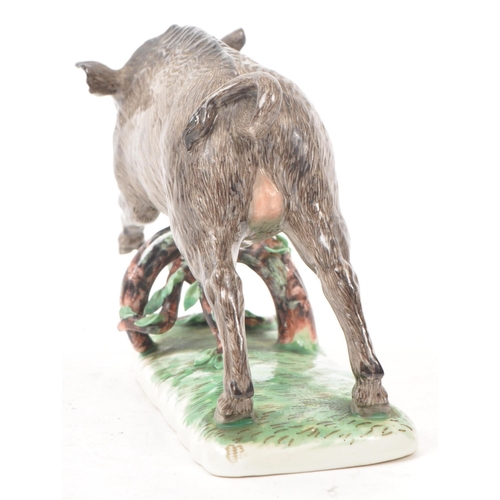 185 - Nymphenburg - After Frankenthal - An early 20th century Nymphenburg Model 1689 porcelain figure of a... 