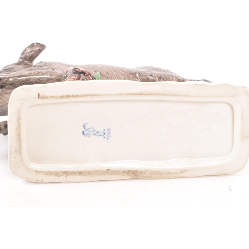 185 - Nymphenburg - After Frankenthal - An early 20th century Nymphenburg Model 1689 porcelain figure of a... 