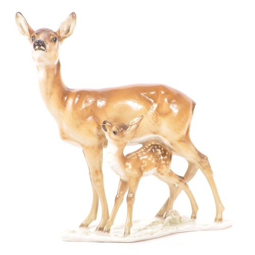 186 - Hutschenreuther - A mid 20th century Hutschenreuther porcelain deer figurine. The figure depicting a... 