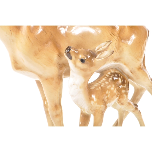 186 - Hutschenreuther - A mid 20th century Hutschenreuther porcelain deer figurine. The figure depicting a... 
