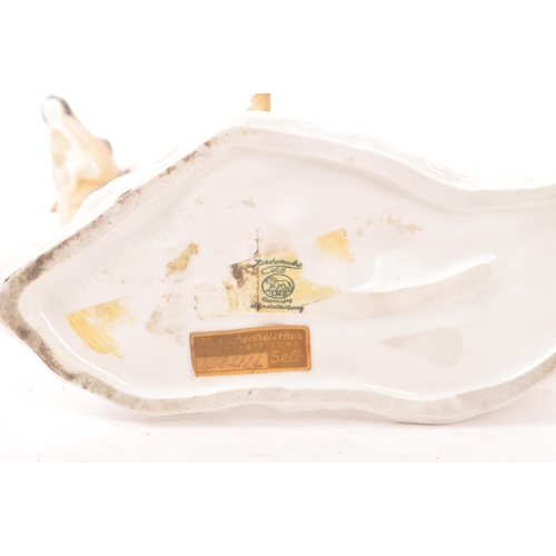 186 - Hutschenreuther - A mid 20th century Hutschenreuther porcelain deer figurine. The figure depicting a... 