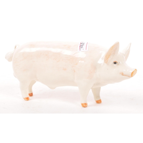 187 - Beswick - A mid 20th century Beswick ' Wall Champion Boy ' porcelain pig figure. The pig in standing... 