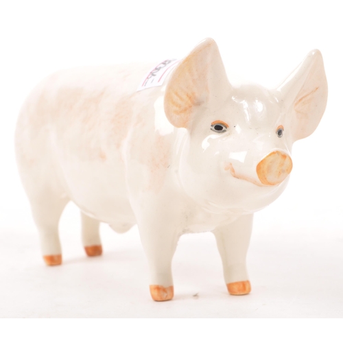187 - Beswick - A mid 20th century Beswick ' Wall Champion Boy ' porcelain pig figure. The pig in standing... 