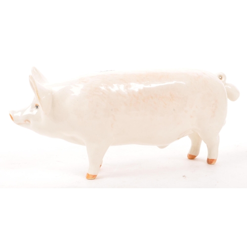 187 - Beswick - A mid 20th century Beswick ' Wall Champion Boy ' porcelain pig figure. The pig in standing... 