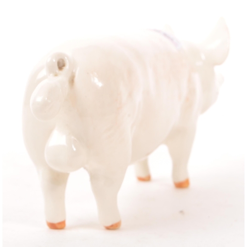 187 - Beswick - A mid 20th century Beswick ' Wall Champion Boy ' porcelain pig figure. The pig in standing... 