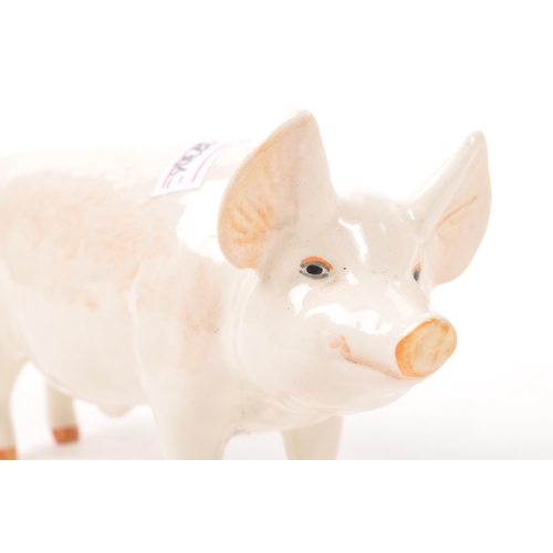 187 - Beswick - A mid 20th century Beswick ' Wall Champion Boy ' porcelain pig figure. The pig in standing... 