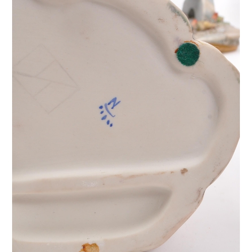 194 - Capodimonte / Royal Doulton - A collection of 20th Century porcelain china figurines comprising of t... 