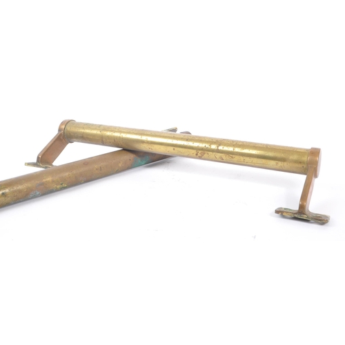 205 - A pair of 19th century brass large door handles. Of circular / cylindrical form with fixings to end.... 