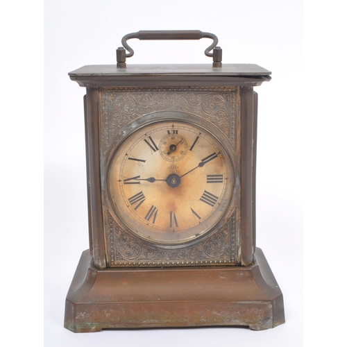 206 - Junghans -  A 19th century base metal carriage style clock with round Roman dial and glass side pane... 