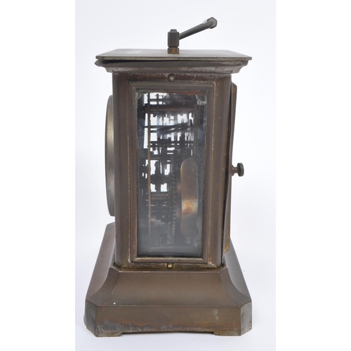 206 - Junghans -  A 19th century base metal carriage style clock with round Roman dial and glass side pane... 