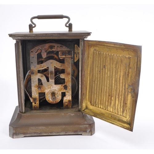 206 - Junghans -  A 19th century base metal carriage style clock with round Roman dial and glass side pane... 