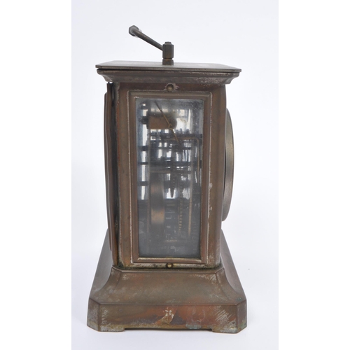 206 - Junghans -  A 19th century base metal carriage style clock with round Roman dial and glass side pane... 