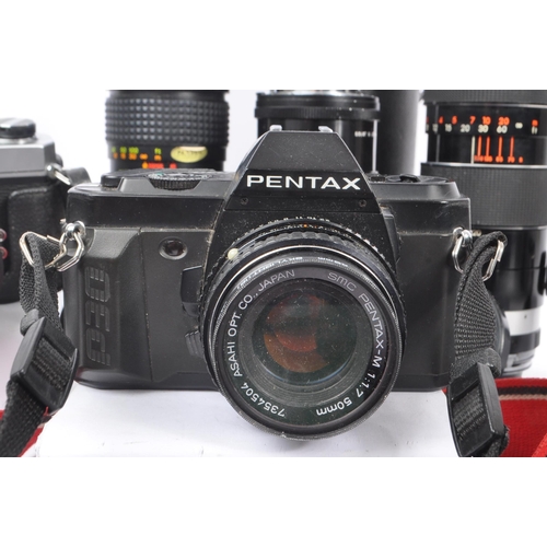 209 - A collection of late 20th century 35mm cameras and lenses. The collection to include Pentax P30N and... 