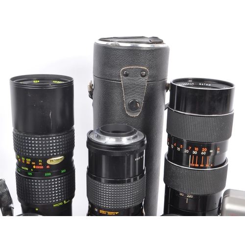 209 - A collection of late 20th century 35mm cameras and lenses. The collection to include Pentax P30N and... 