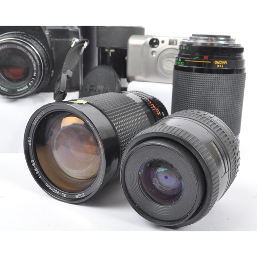 209 - A collection of late 20th century 35mm cameras and lenses. The collection to include Pentax P30N and... 