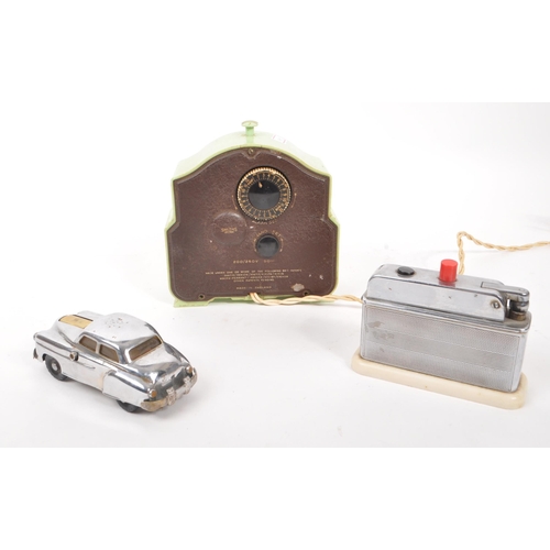 215 - An early 20th century Art Deco Smiths bakelite mantel clock, alongside two early 20th century table ... 