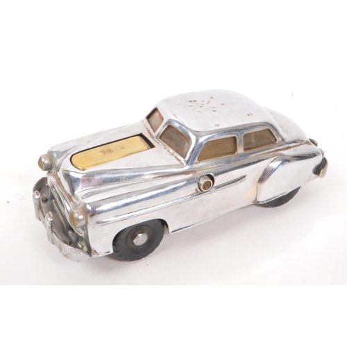 215 - An early 20th century Art Deco Smiths bakelite mantel clock, alongside two early 20th century table ... 