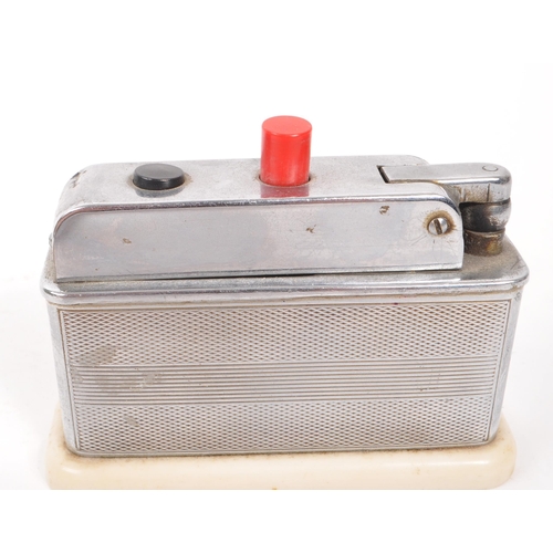 215 - An early 20th century Art Deco Smiths bakelite mantel clock, alongside two early 20th century table ... 