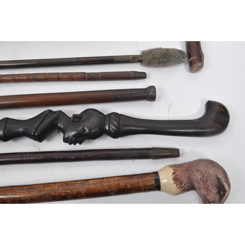 216 - A collection of Edwardian and later swagger sticks / walking canes. Some examples including duck hea... 