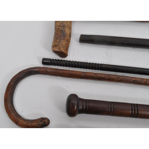 216 - A collection of Edwardian and later swagger sticks / walking canes. Some examples including duck hea... 