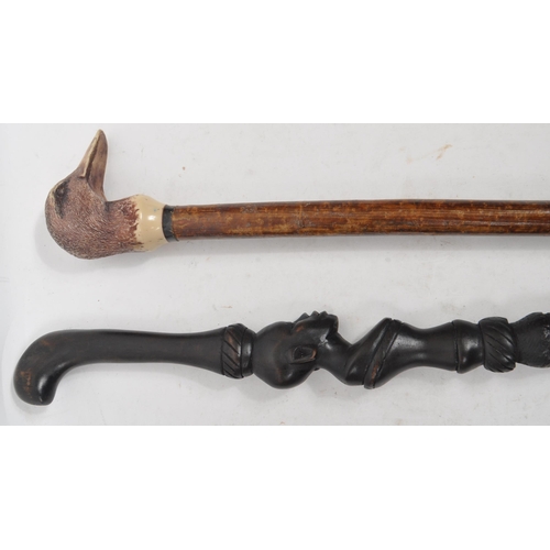 216 - A collection of Edwardian and later swagger sticks / walking canes. Some examples including duck hea... 